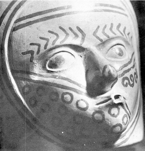 Mochica vase showing a tattooed man in the act of mocha, or ritual kissing.